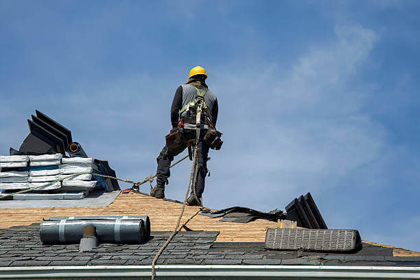 Professional Gutter Installation technician working in Rockaway Park, NY